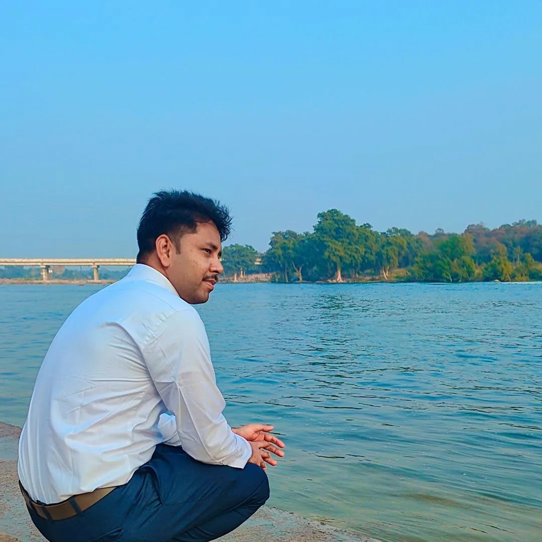 Shanu Quraishi sitting by a river